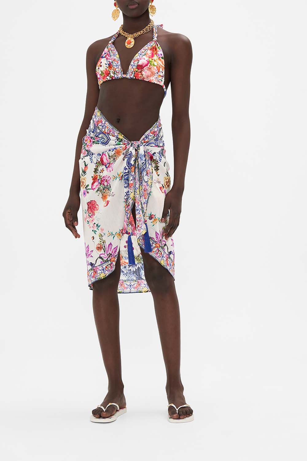 Front view of model wearing CAMILLA resort wear sarong in Dutch Is Life print