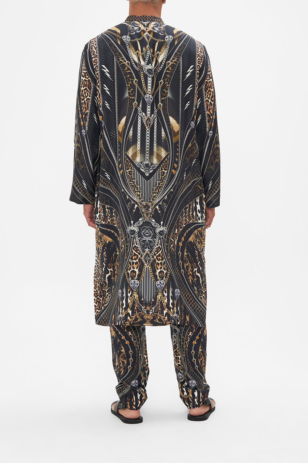 Back view of model wearing Hotel Franks by CAMILLA mens silk kaftan in Chaos In The Cosmos animal print