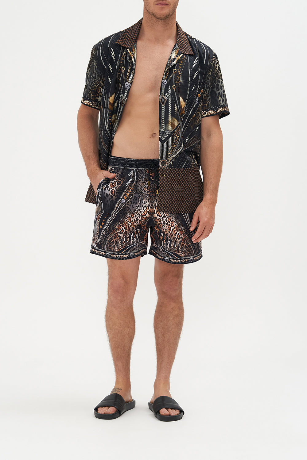 Front view of model wearing Hotel Franks by CAMILLA mens elastic waist boardshorts in Chaos In The Cosmos animal print