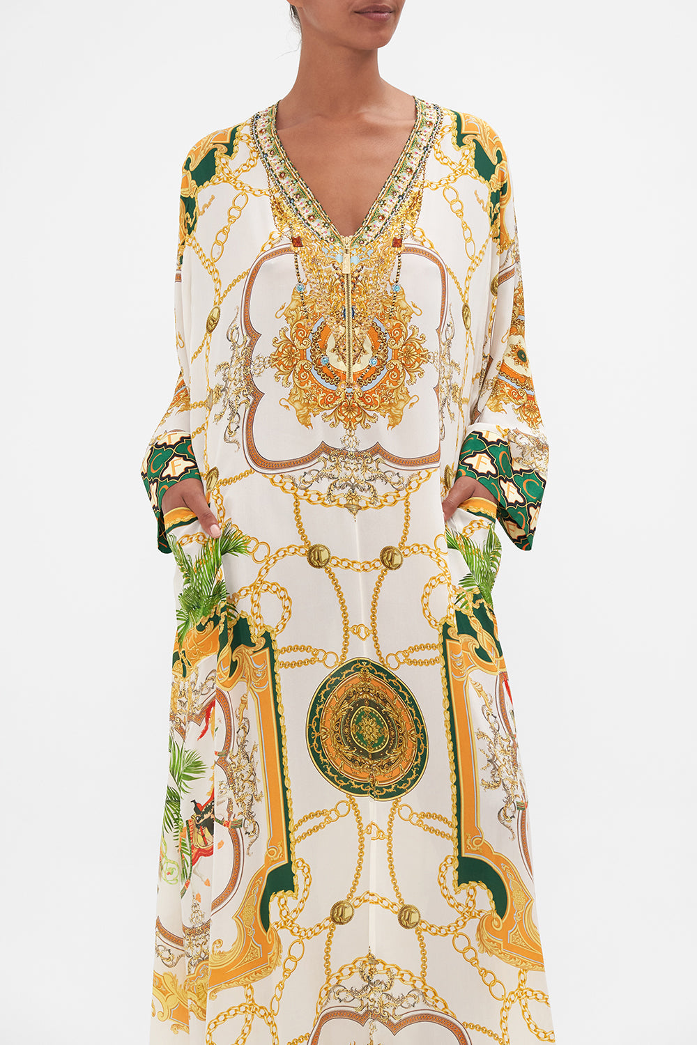 Crop view of model wearing CAMILLA white silk kaftan My Sweet Devotion print