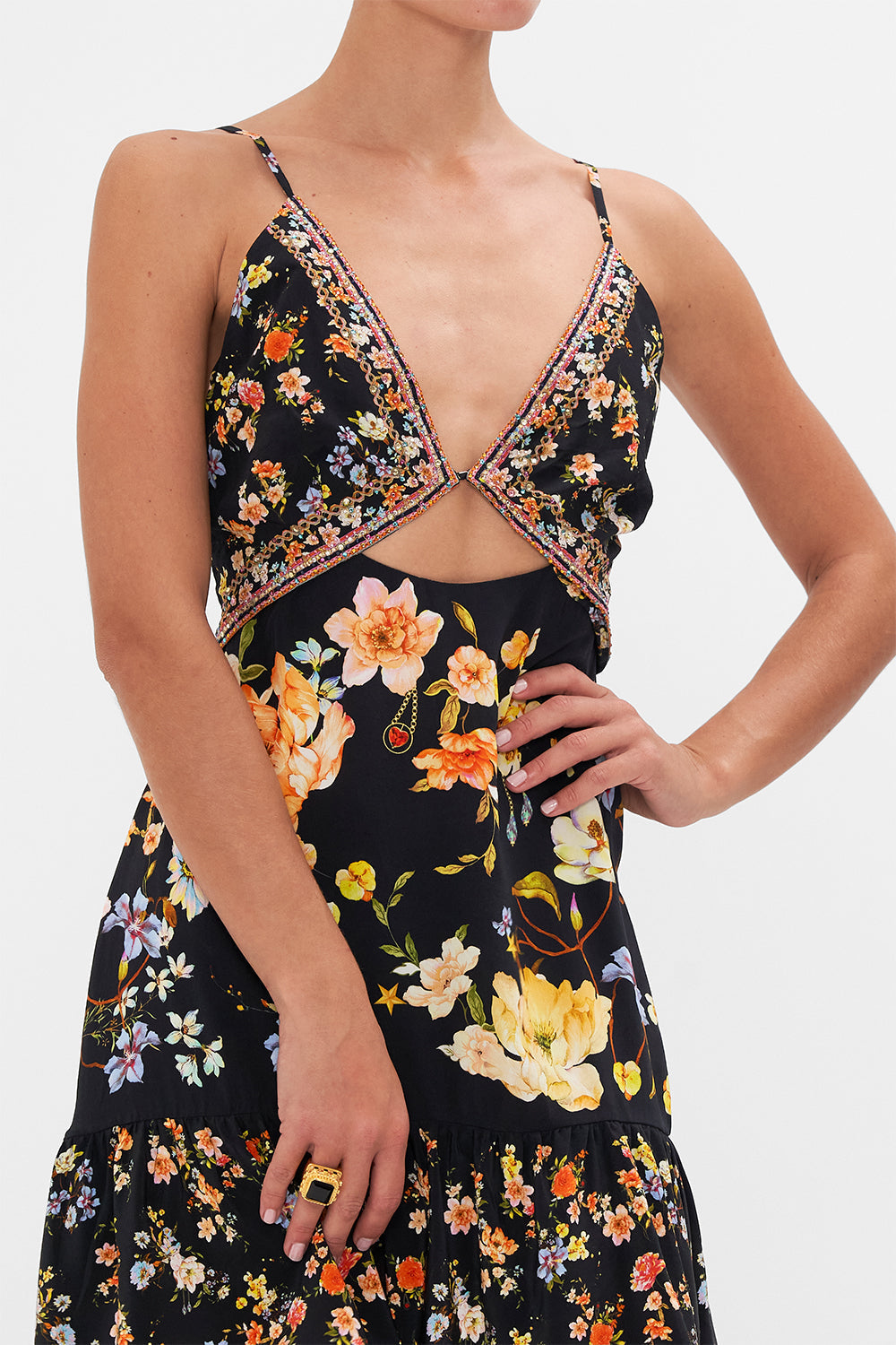 Detail view of model wearing CAMILLA floral silk mini dress in Secret History print