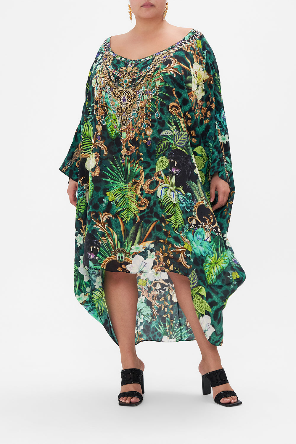 Front view of curvy model wearing CAMILLA plus size green tropical print silk dress in Sing My Song print