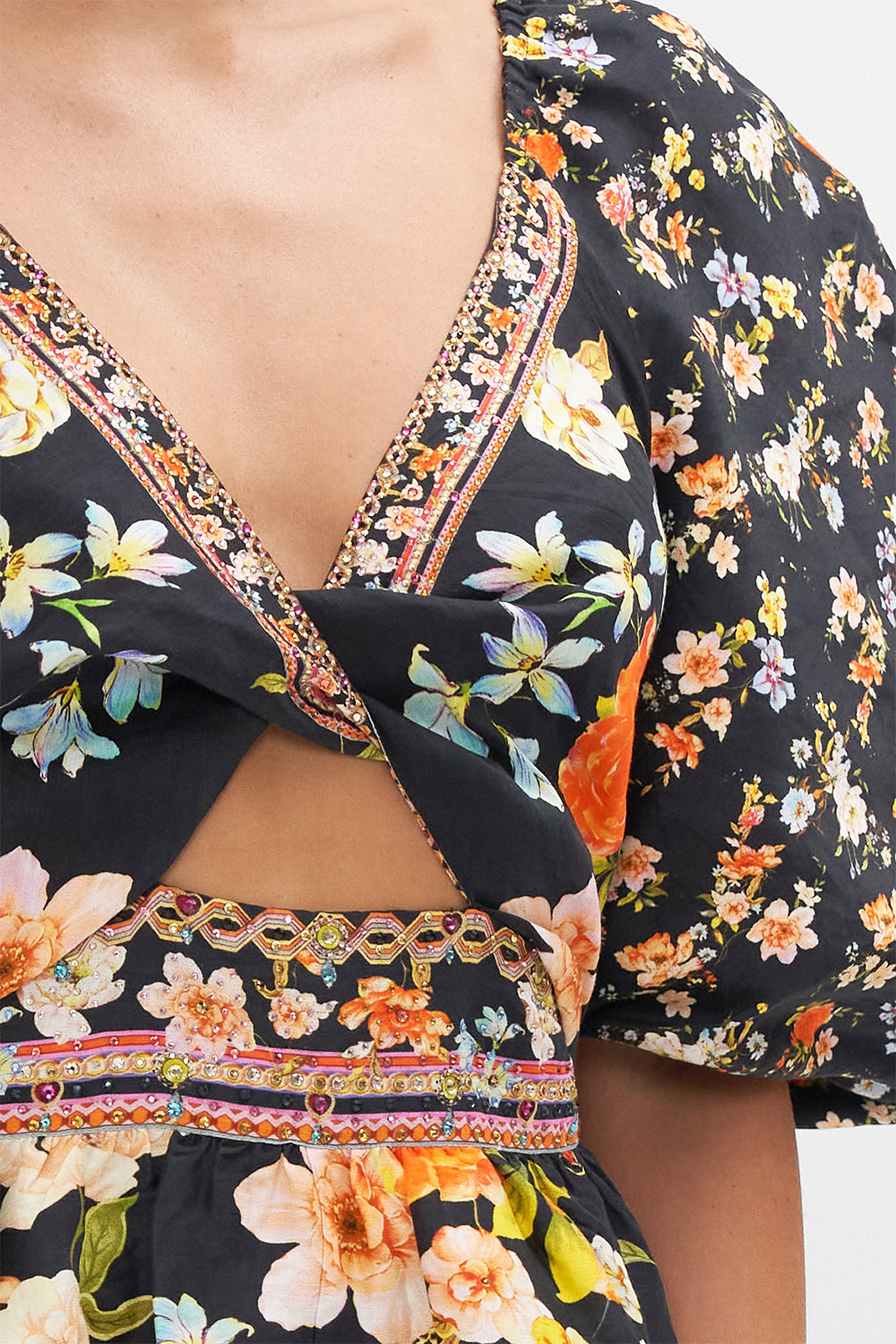 Detail view of model wearing CAMILLA floral mini dress in Secret History print