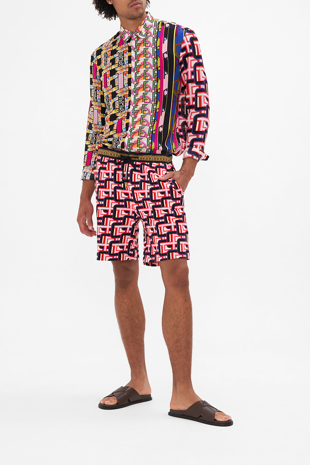 Front view of model wearing HOTEL FRANKS BY CAMILLA mens track short in Rome Retro print