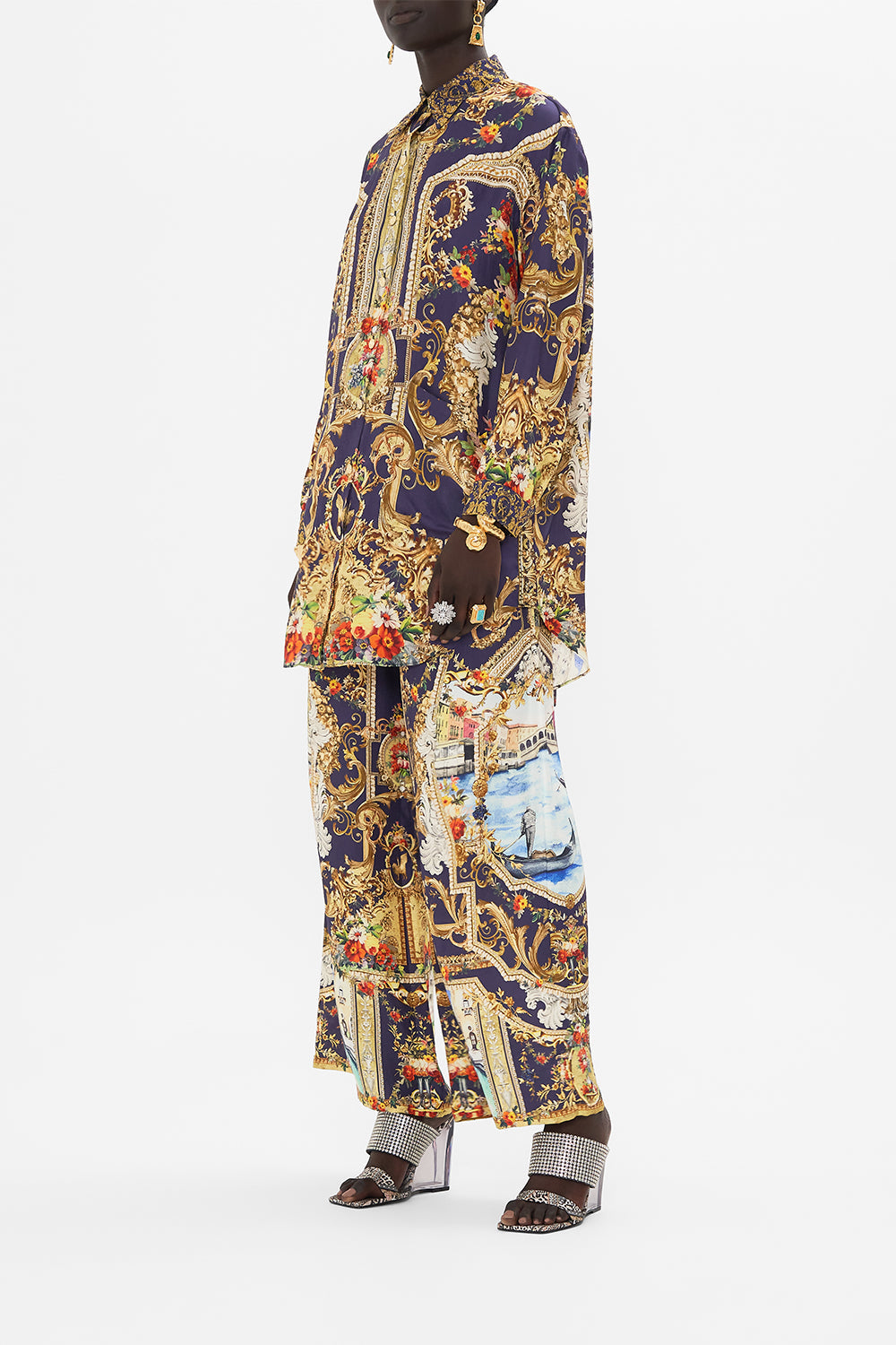 Side view of model wearing CAMILLA floral shirt tunic in Flowers Of Neptune print