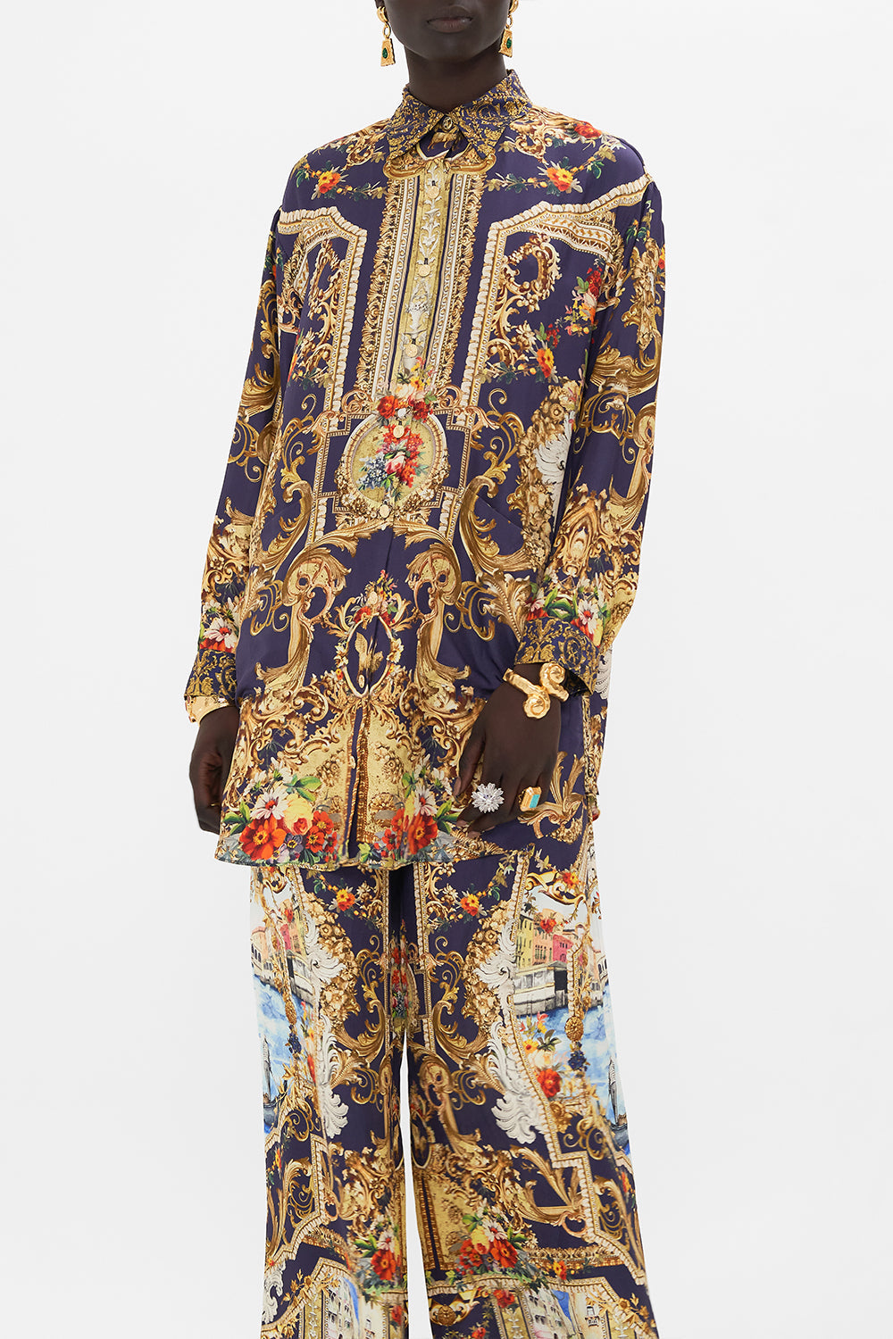 Crop view of model wearing CAMILLA floral shirt tunic in Flowers Of Neptune print