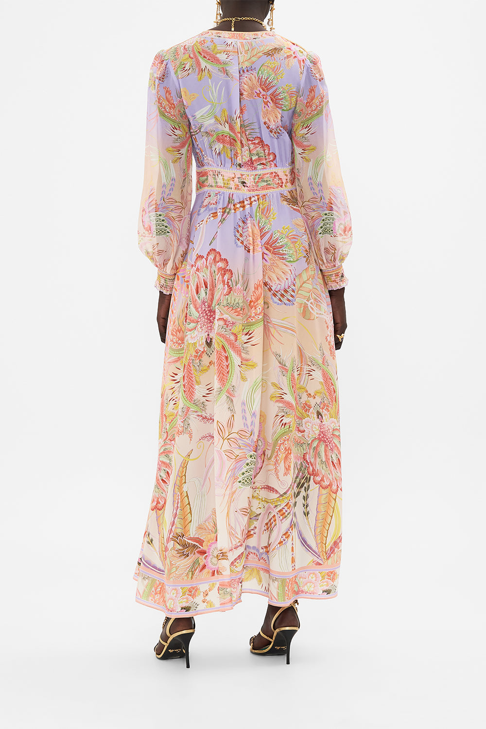 Back view of model wearing CAMILLA designer silk dress in Cosmic Tuscan print