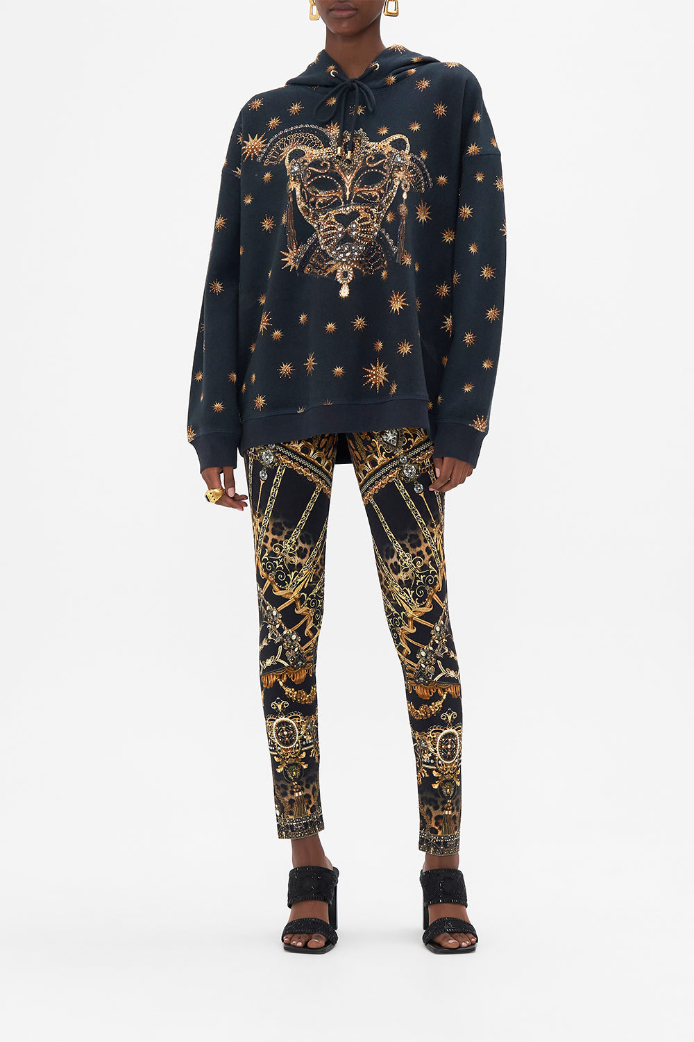 Front view of model wearing CAMILLA luxury hoody in Masked At Moonlight print