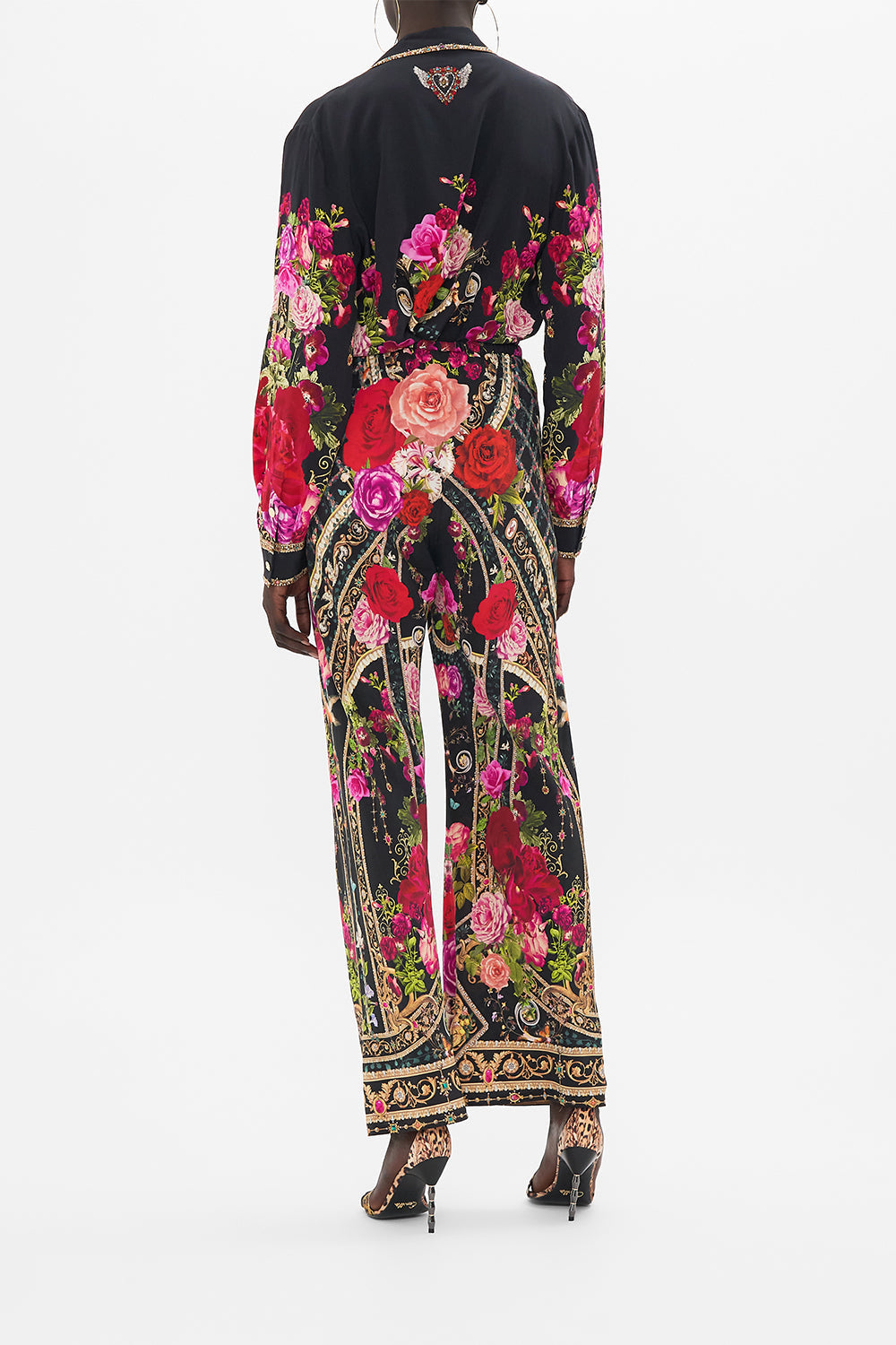 Back view of model wearing CAMILLA drawstring silk pants in Reservation For Love