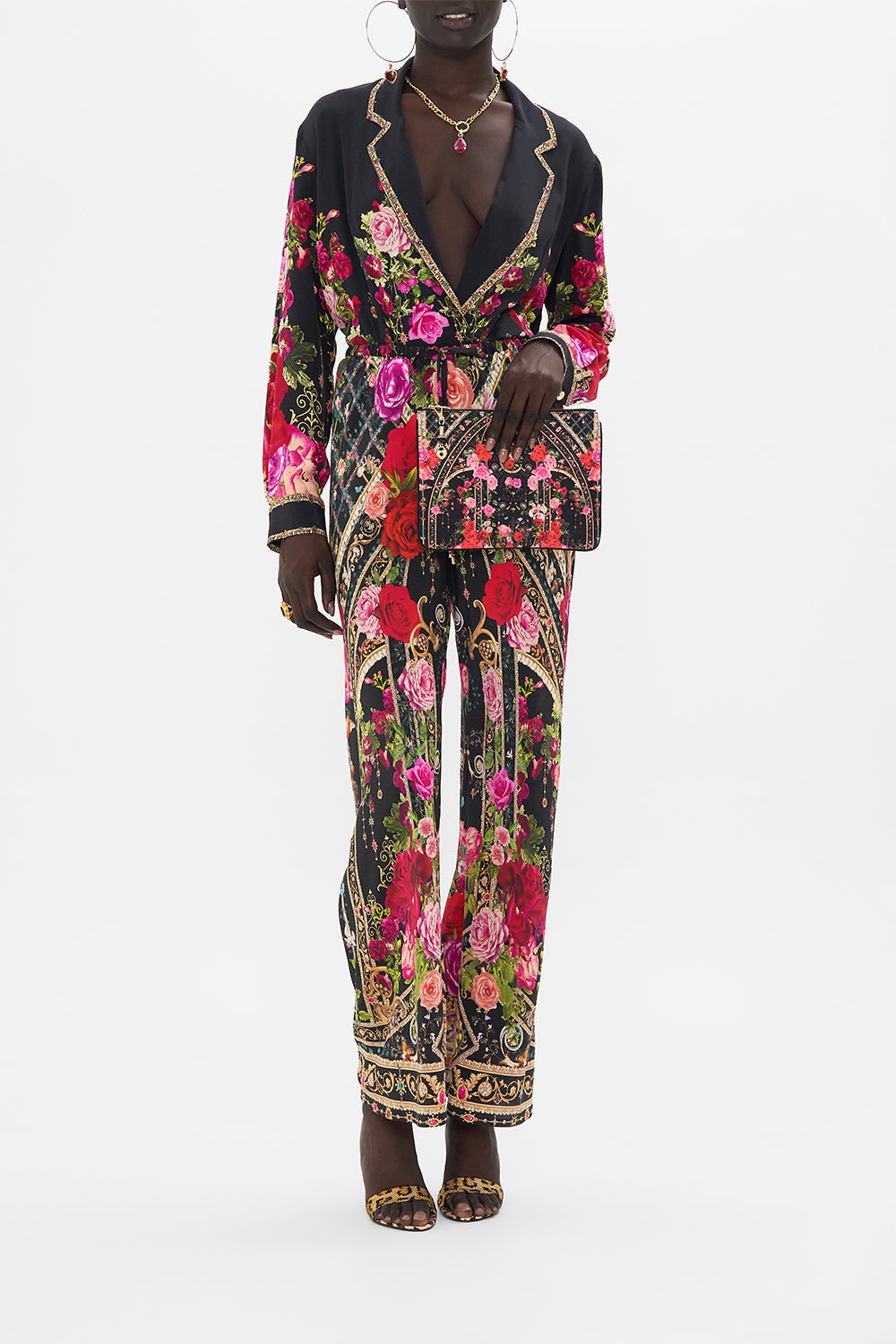 Product view of CAMILLA designer clutch bag in Reservation For Love print