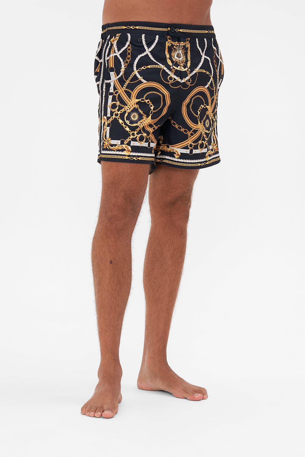 Crop view of model wearing Hotel Franks By CAMILLA mens swim short in Coast to Coast print