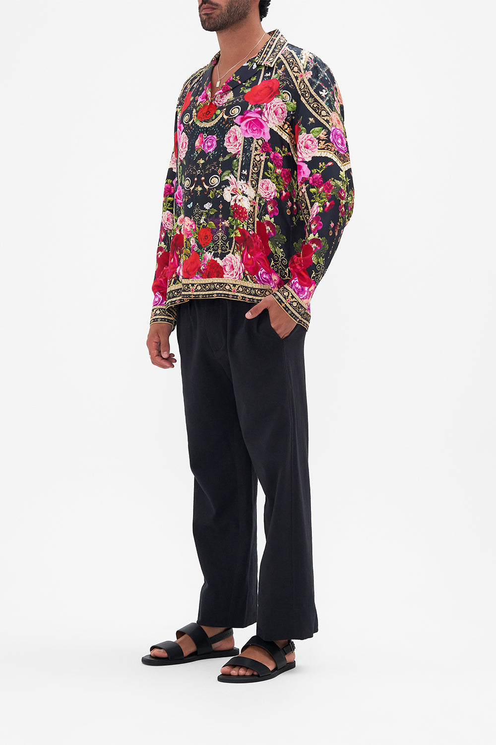 Side view of model wearing Hotel Franks by CAMILLA mens floral camp collared shirt in Reservation For Love print