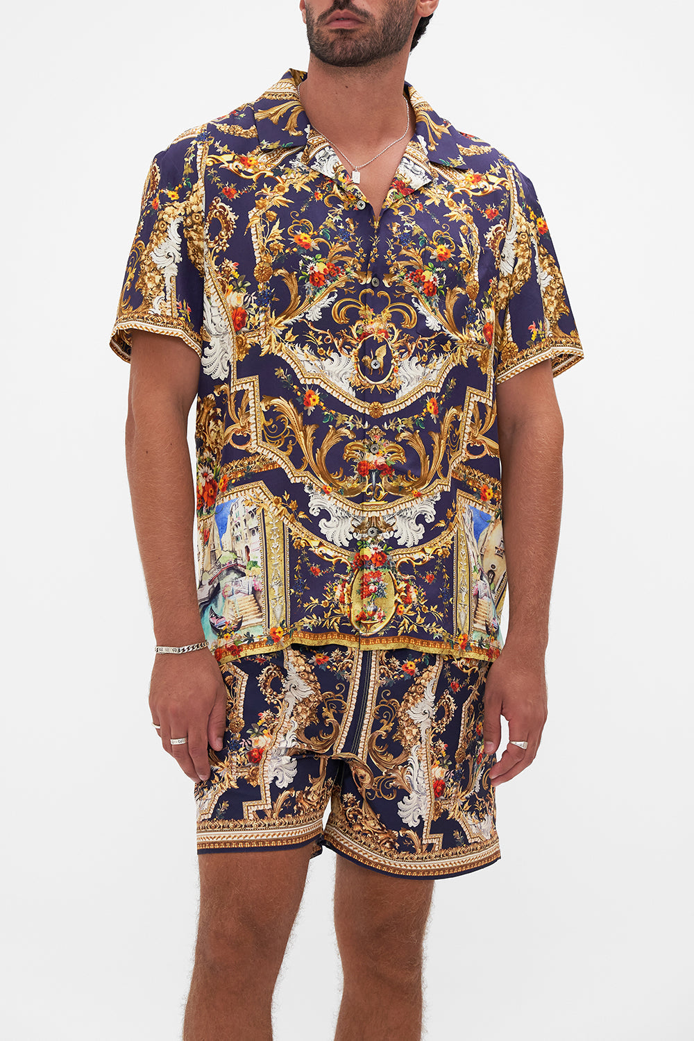 Crop view of model wearing Hotel Franks By CAMILLA mens short sleeve camp collared shirt in Venice Vignette print