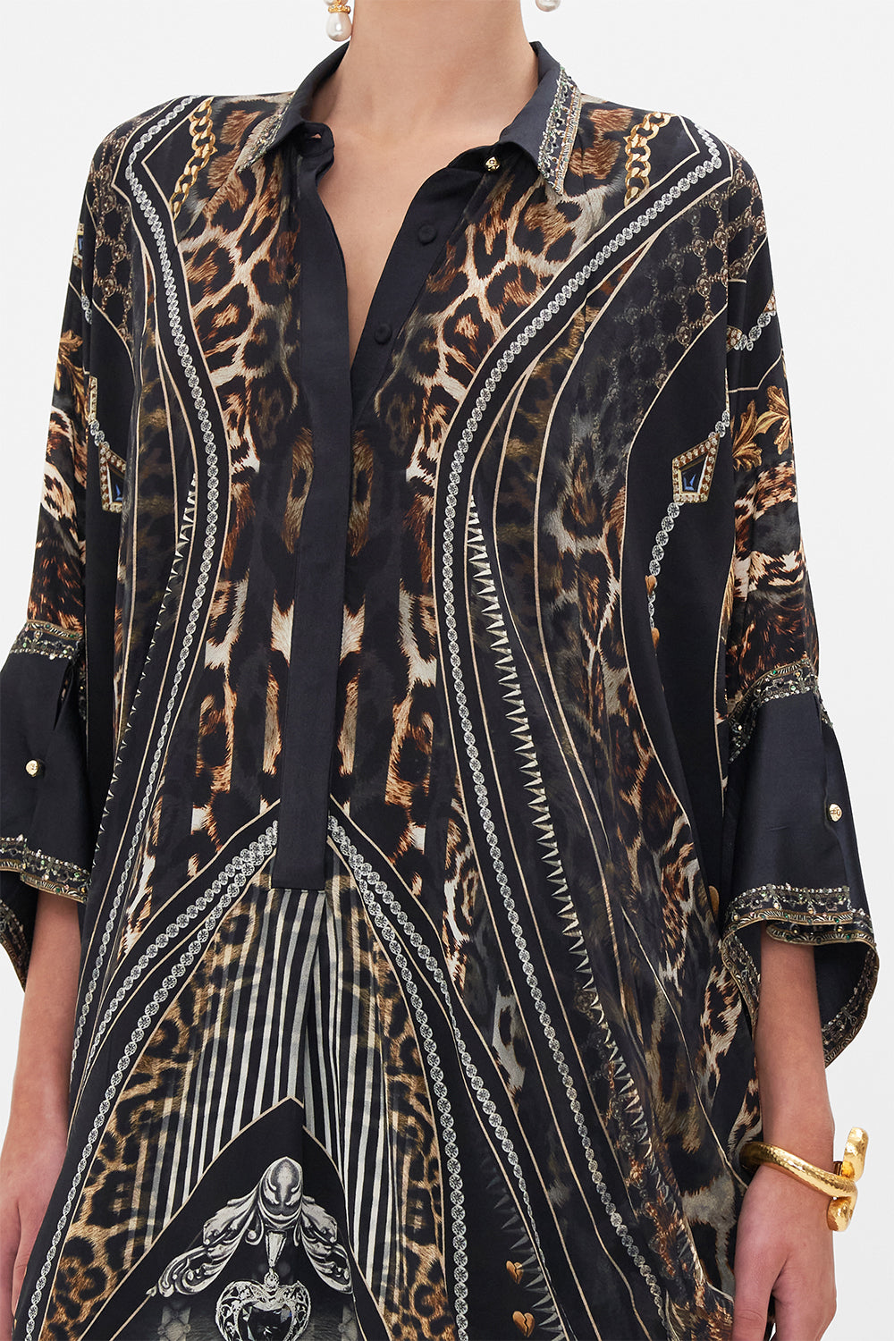 Detail view of model wearing CAMILLA silk shirt in Chaos In The Cosmos animal print