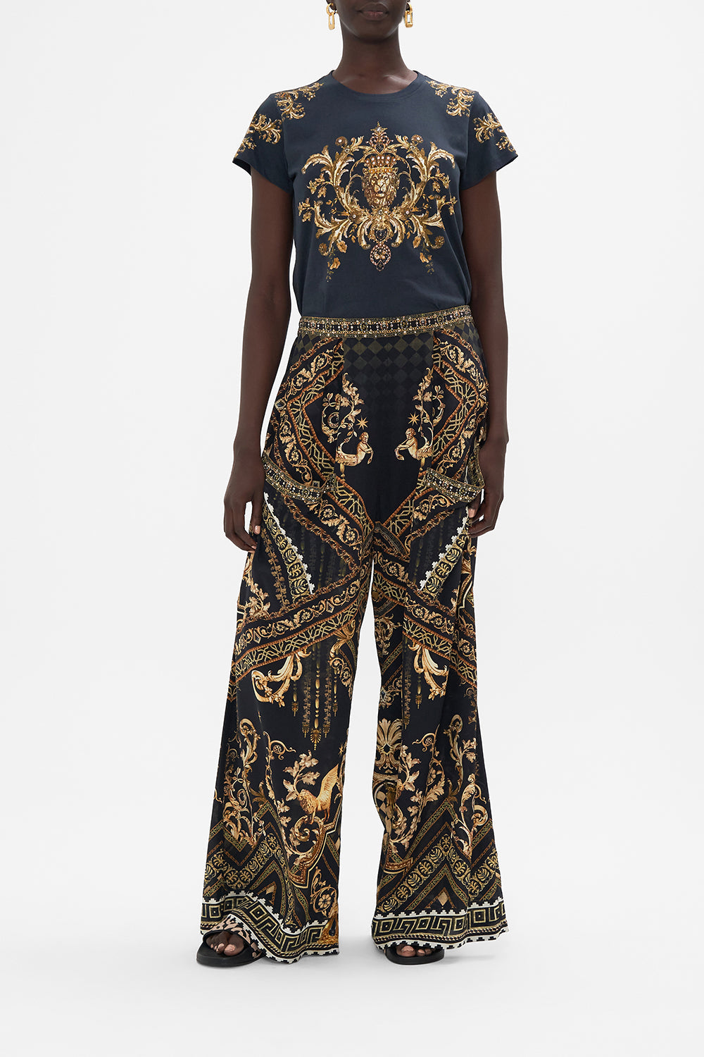 Front view of model wearing CAMILLA silk pants in Duomo Dynasty print
