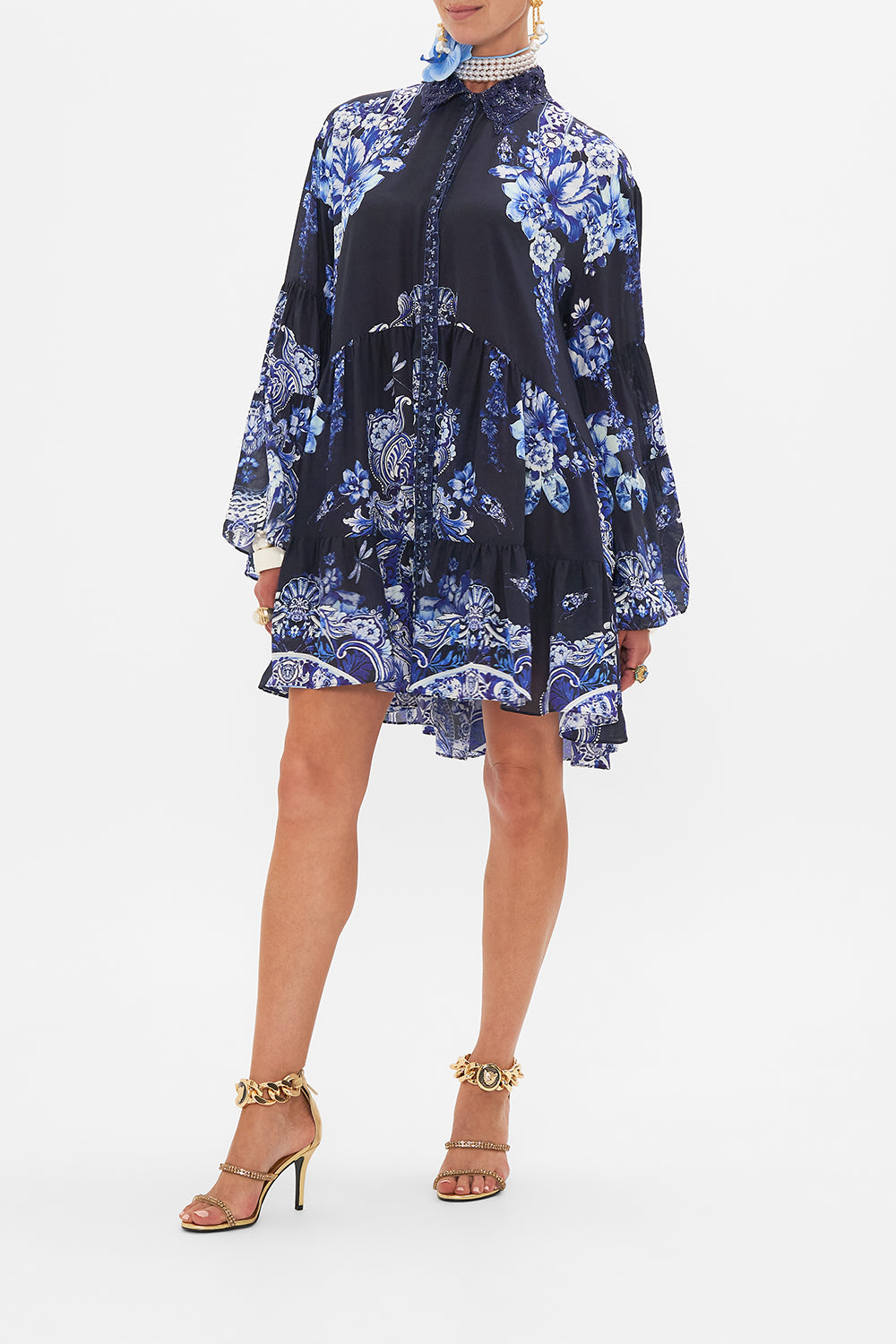 Side view of model wearing CAMILLA silk shirt dress in Delft Dynasty print