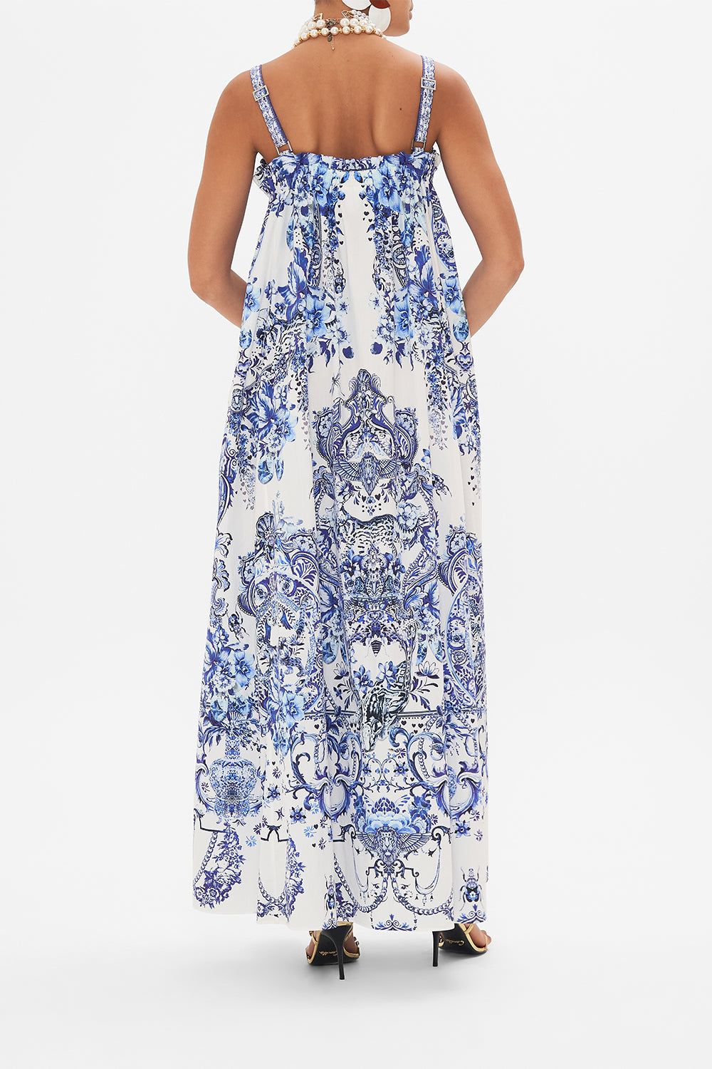 Back view of model wearing CAMILLA blue and white sun dress in Glaze and Graze print
