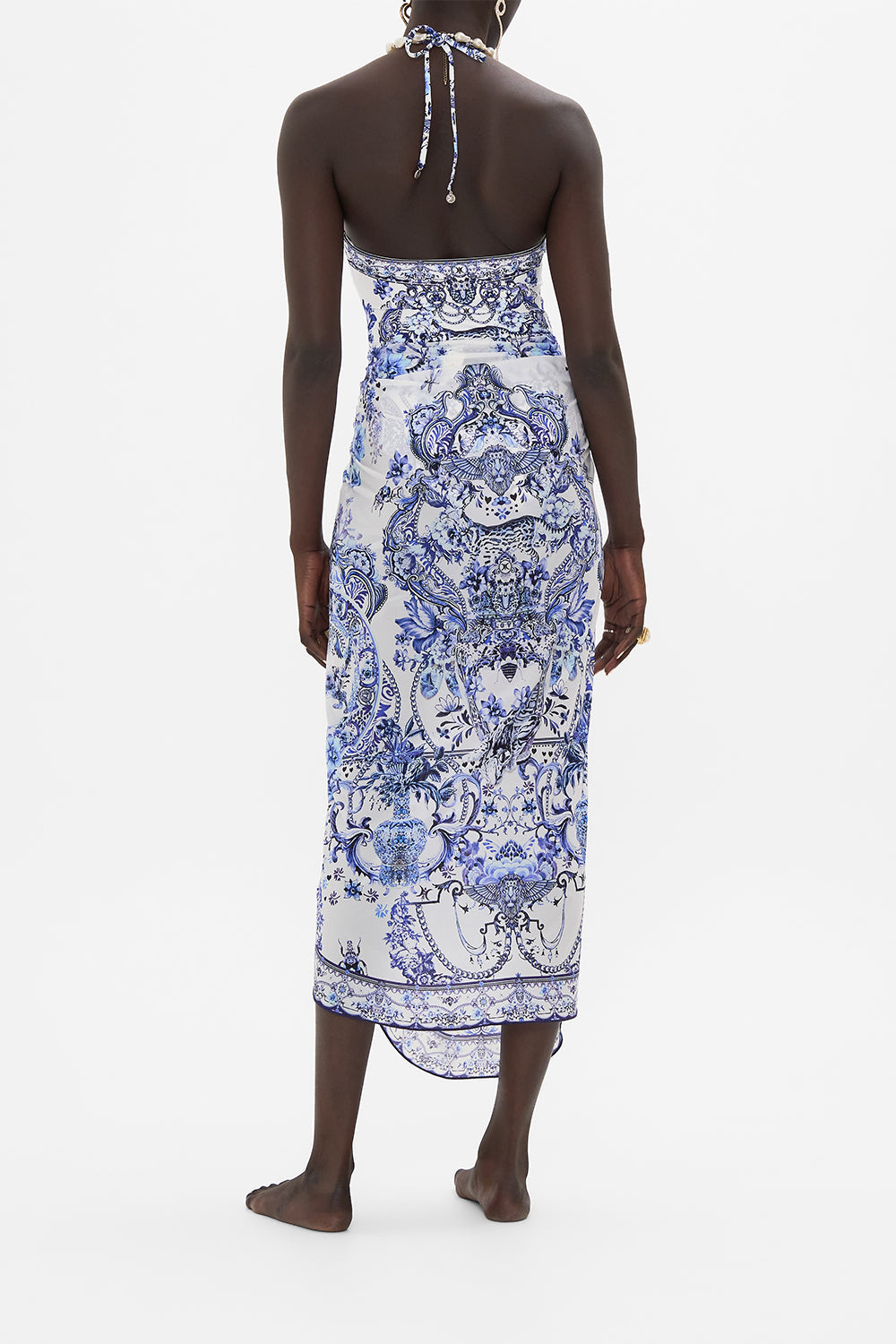 Back view of model wearing CAMILLA resort wear sarong in Glaze and Graze print