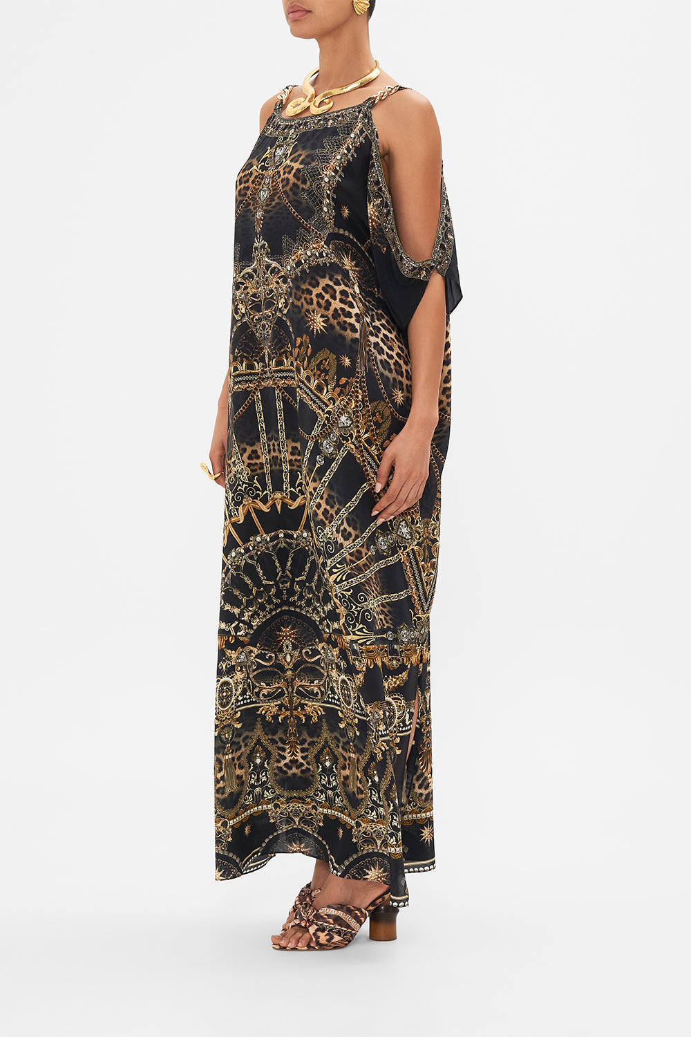 Side view of model wearing CAMILLA silk kaftan with hardware in Masked at Moonlight print