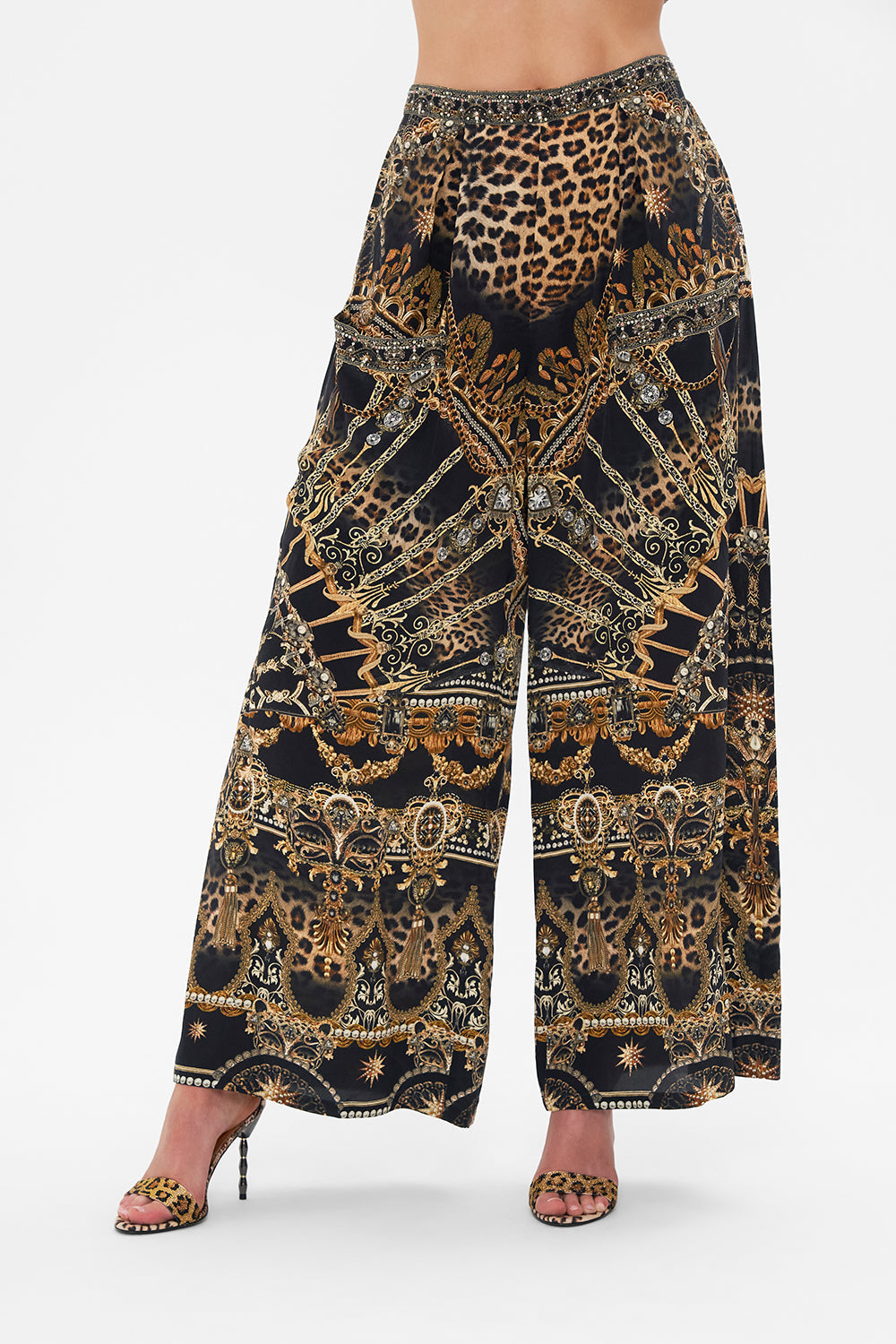 Crop view of model wearing CAMILLA silk palazzo pants in Masked At Moonlight print