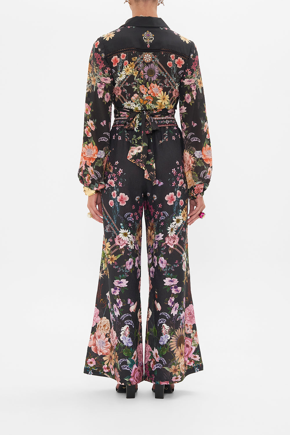 Back view of model wearing CAMILLA linen lounge pant in Letters From A Vineyard print