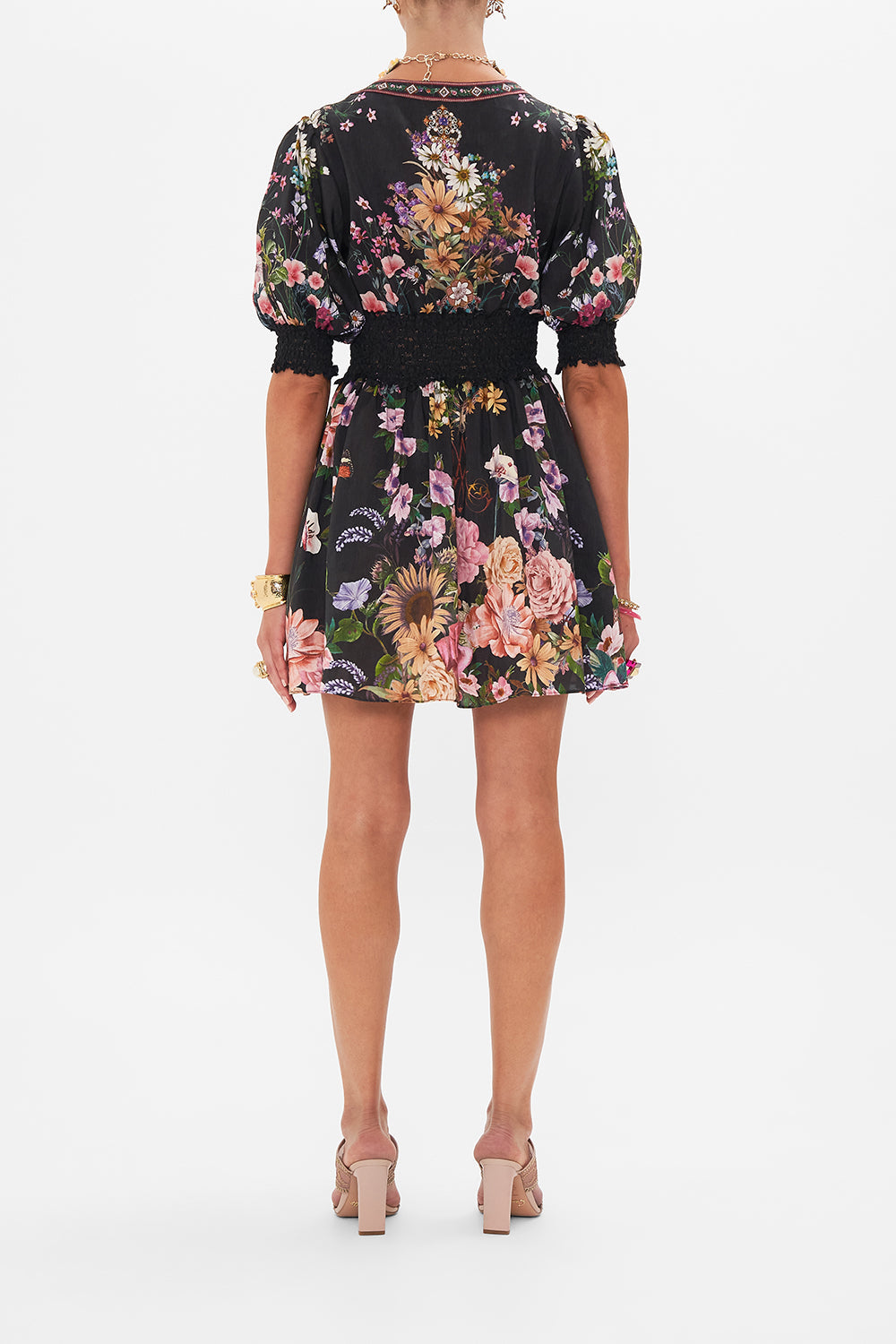 Back view of model wearing CAMILLA silk mini dress in Letters From A Vineyard print