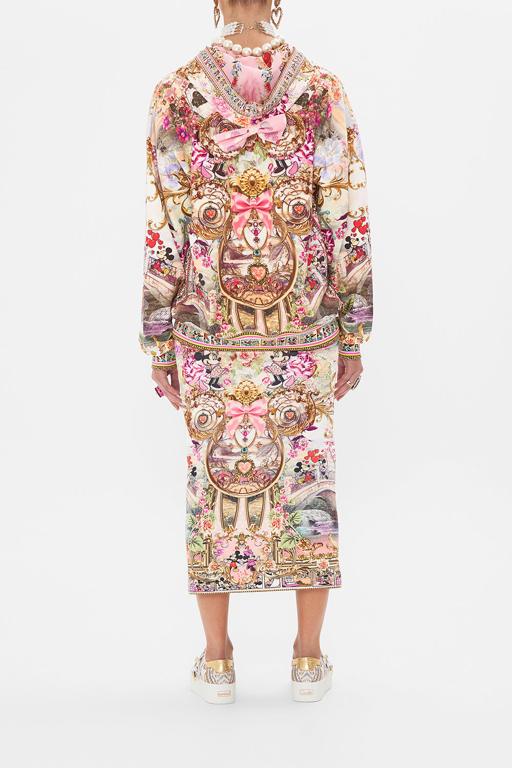 Back view of model wearing CAMILLA x Disney hoodie in Minnie Mouse Magic print