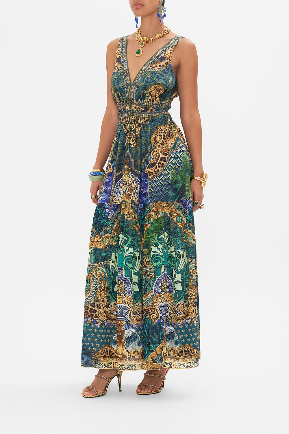 Side view of model wearing CAMILLA silk maxi dress in Peacock Rock print