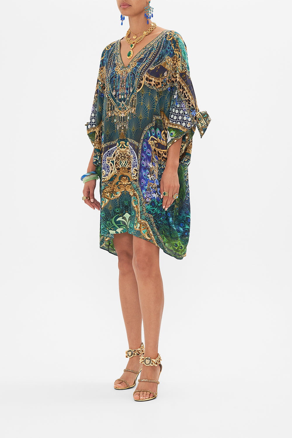 Crop view of model wearing CAMILLA short silk kaftan in Fan Dance print