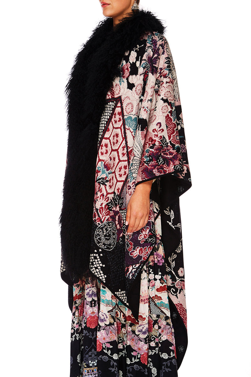 CAMILLA NIGHTS WITH HER REVERSIBLE OVERSIZED PONCHO W FUR