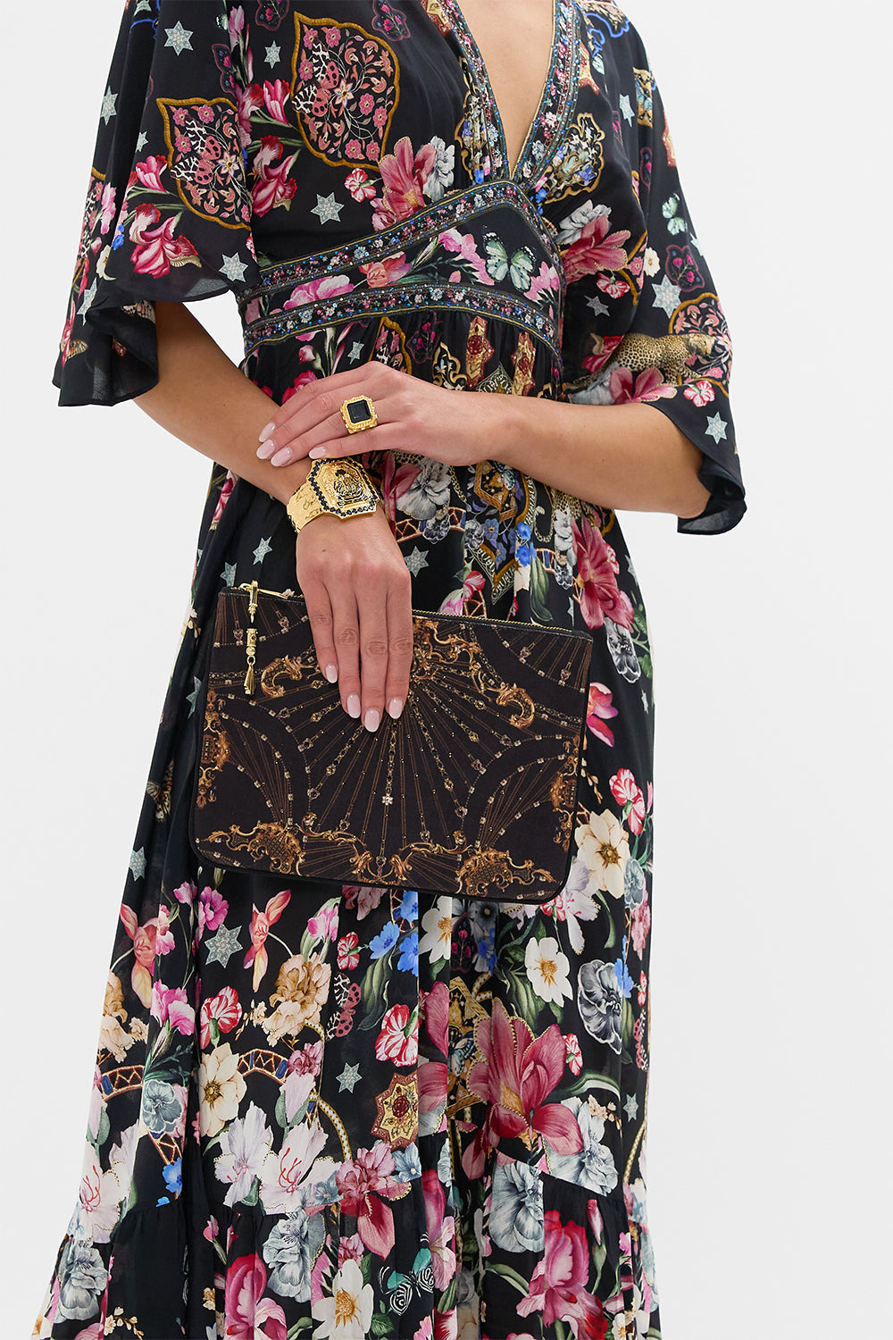 The CAMILLA SMALL CANVAS CLUTCH BAROQUE AROUND THE CLOCK in our  print.