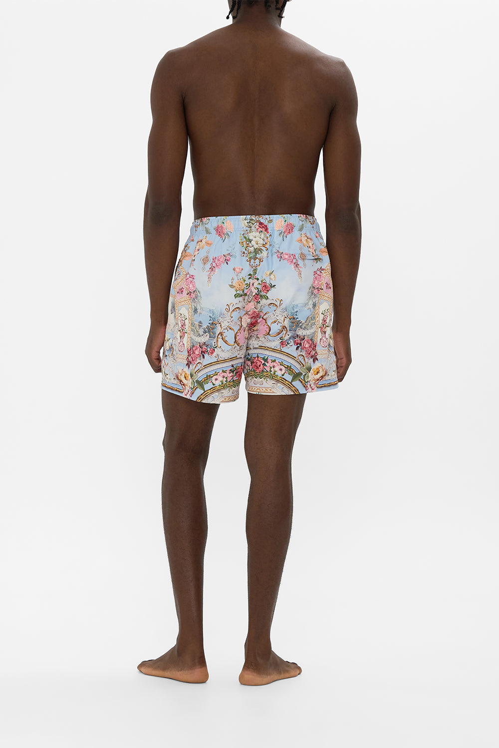 The CAMILLA MID LENGTH BOARDSHORT WITH ELASTIC WAIST TILED IN TIME in our  print.