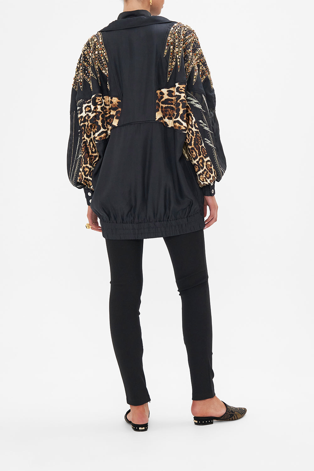 Back view of model wearing CAMILLA animal print jacket in Chaos In The Cosmos print