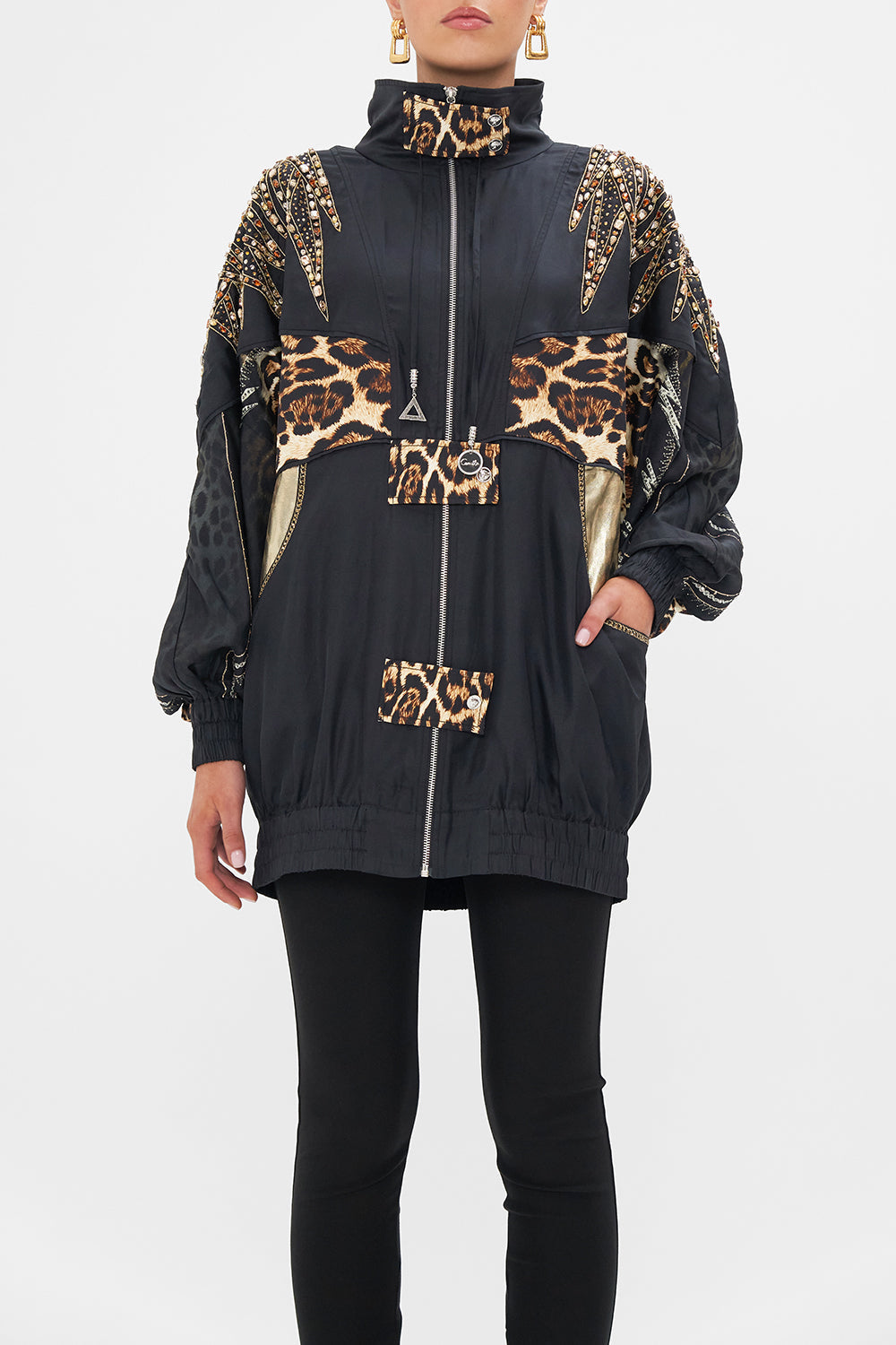 Crop view of model wearing CAMILLA animal print jacket in Chaos In The Cosmos print