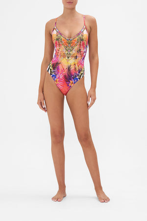 Front view of model wearing CAMILLA tropical print one piece swimsuit in Wild Loving print