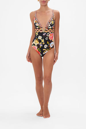 Front view of model wearing CAMILLA floral one piecve swimsuit in Secret History print