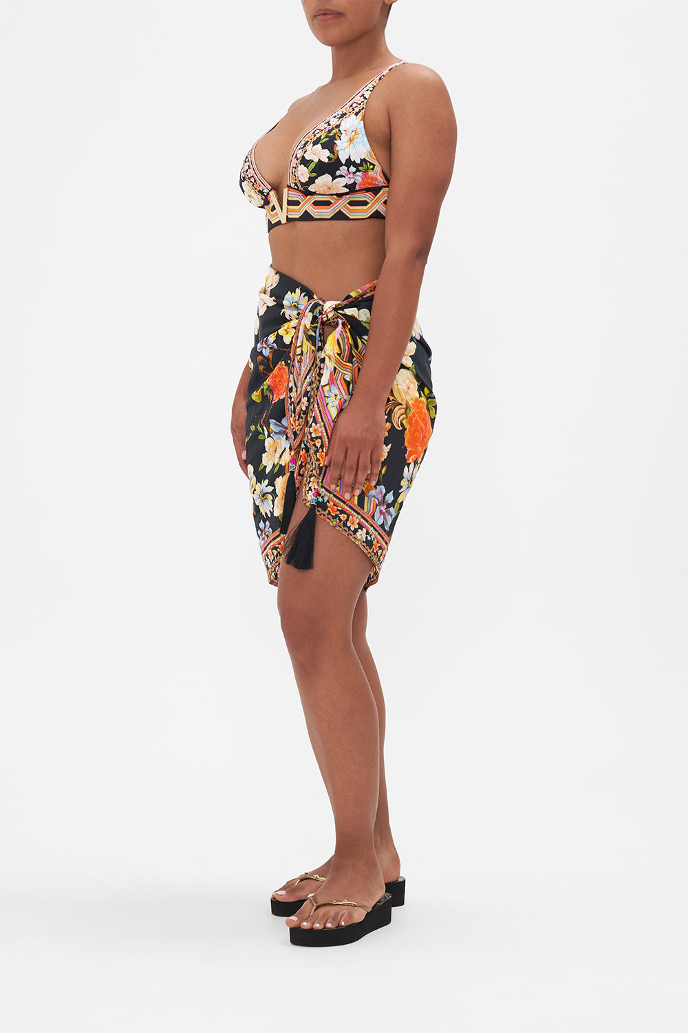 Side view of model wearing CAMILLA silk cotton sarong in Wild Loving tropical print 