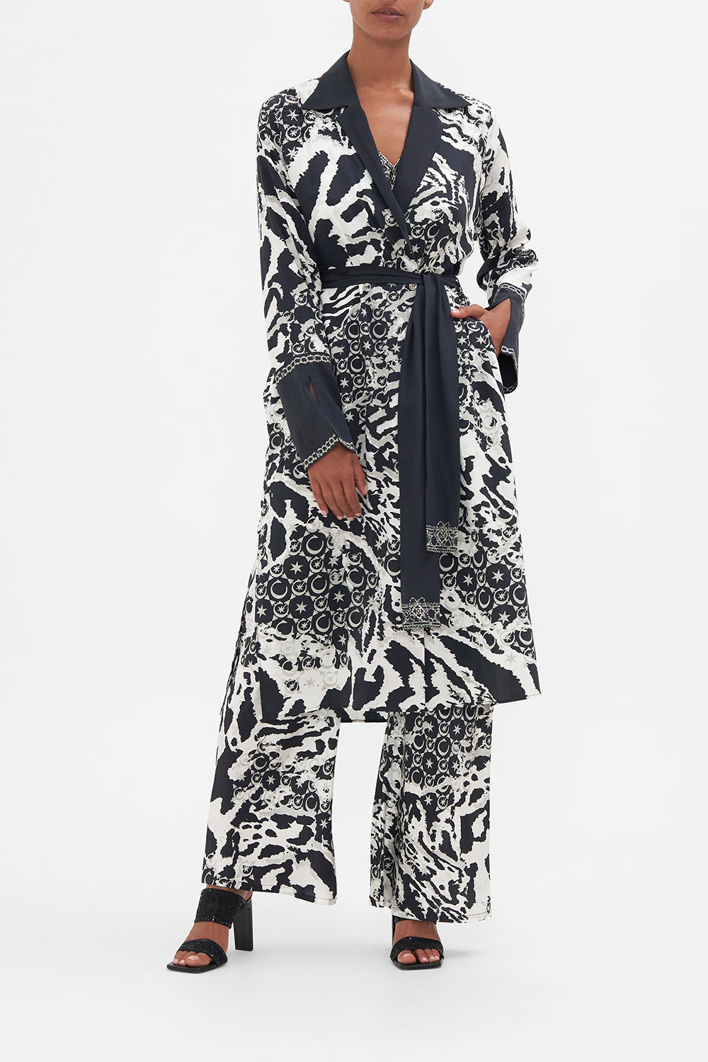 Front view of model wearing CAMILLA silk coat in Feline Fantasy print