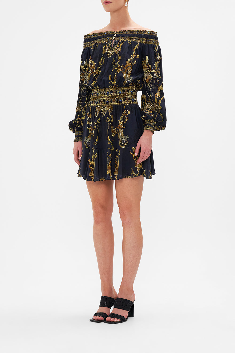 Side view of model wearing CAMILLA off the shoulder dress in Moonlight Melodies print