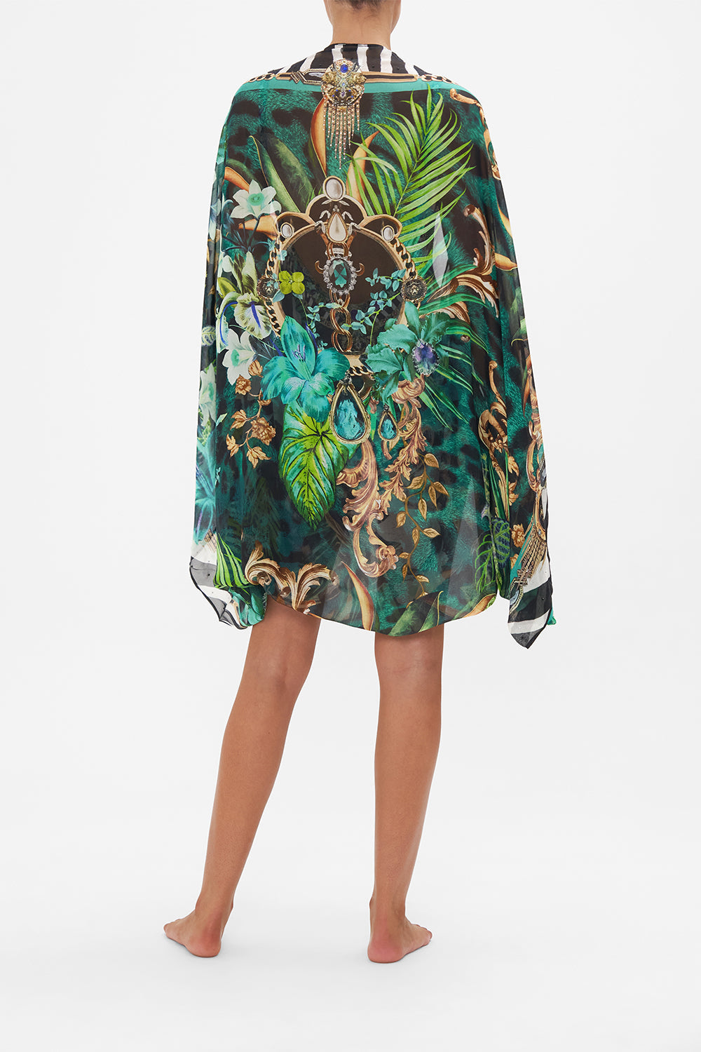 Back view of model wearing CAMILLA silk shrug in Sing My Song print