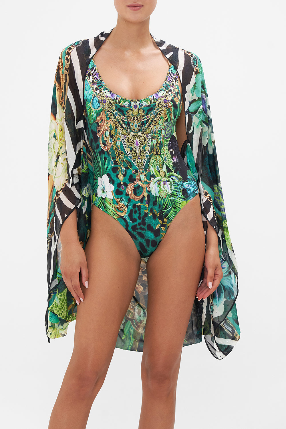 Crop view of model wearing CAMILLA silk shrug in Sing My Song print