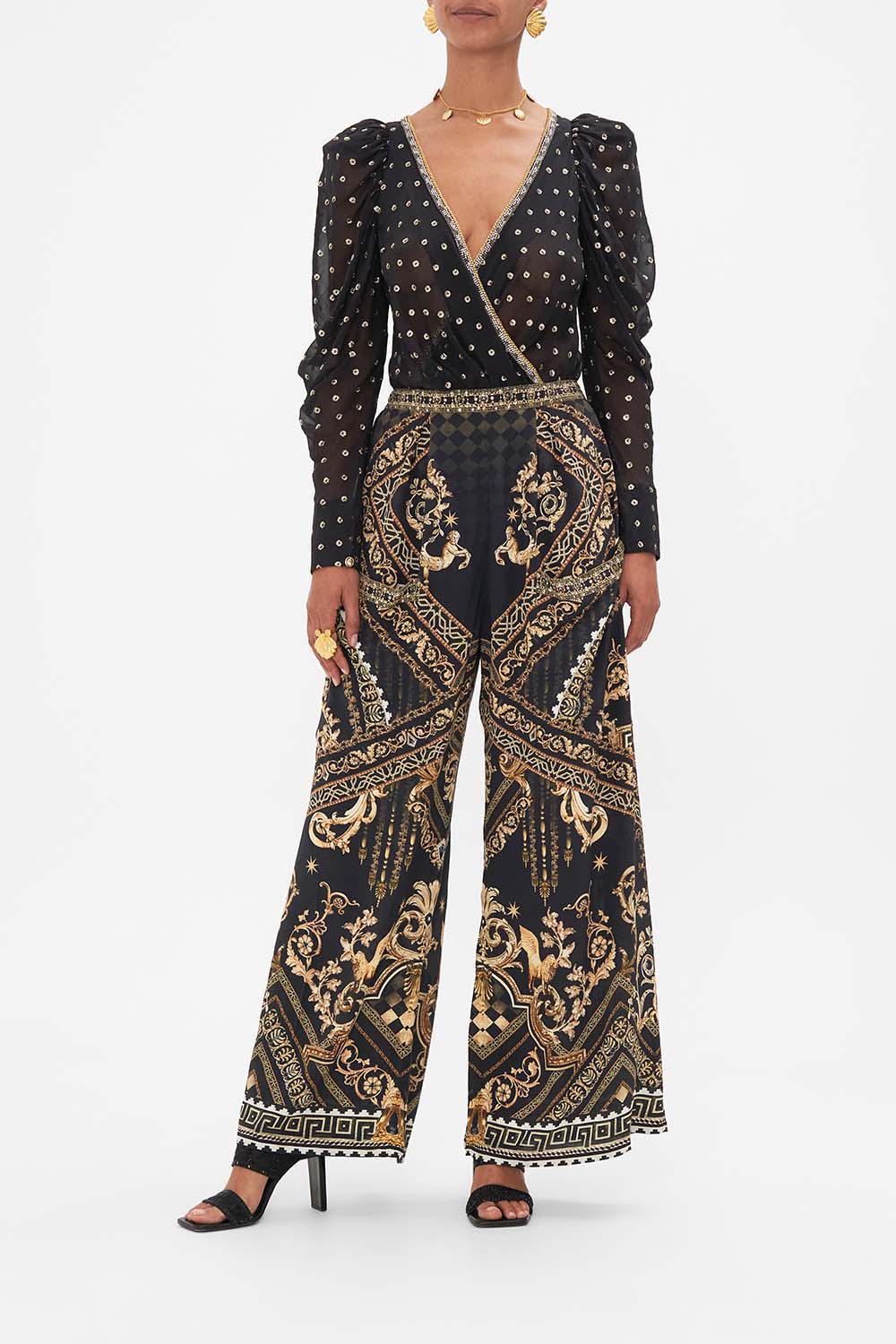 Front view of model wearing CAMILLA black and gold wrap bodysuit in Duomo Dynasty print