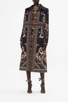 Front view of model wearing CAMILLA black and gold coat in Duomo Dynasty