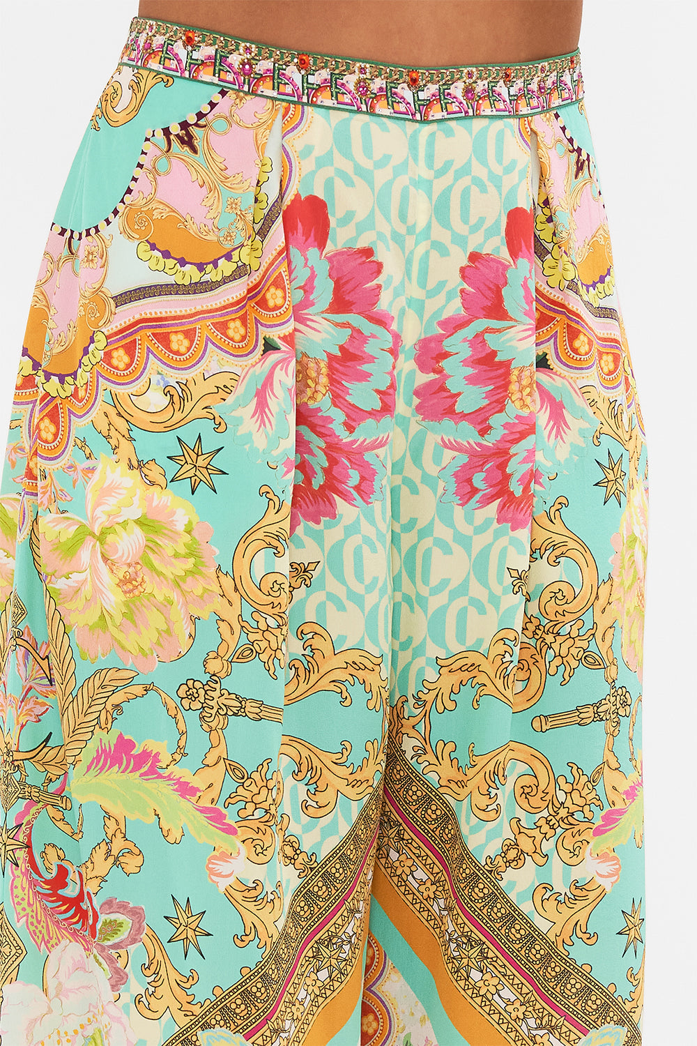 Detail view of model wearing CAMILLA silk tuck front pant in An Italian Welcome print