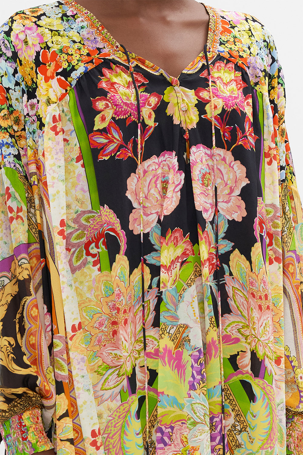 Detail view of model wearing CAMILLA silk blouse in Sundowners in Sicily print