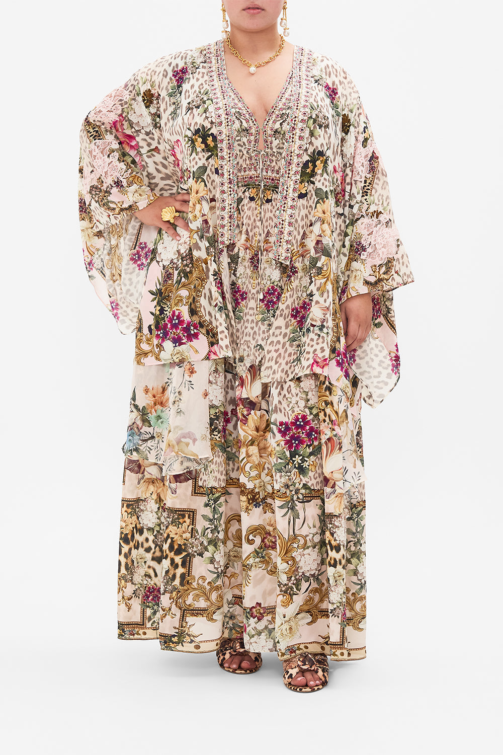 Front view of curvy model wearing CAMILLA plus size silk kimono layer in Bambino Bliss print