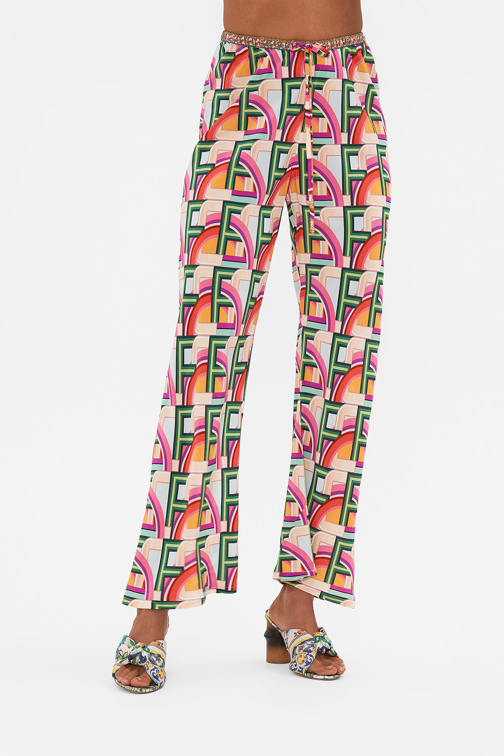 Crop view of model wearing CAMILLA silk drawstring pant in An Italian Welcome print