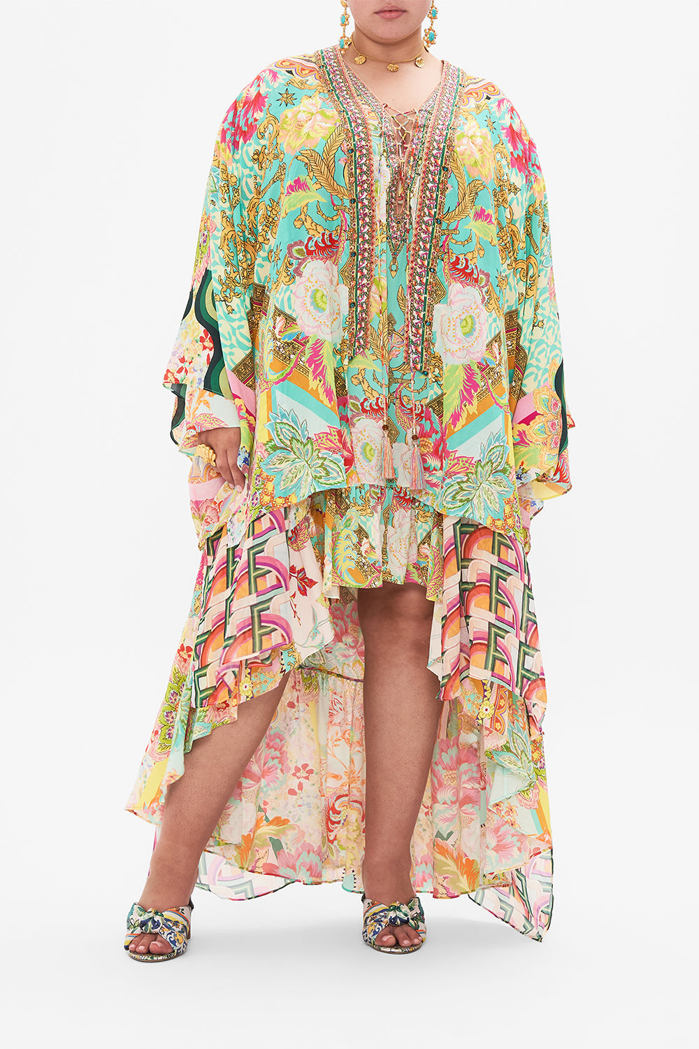 Front view of curvy model wearing CAMILLA plus size silk kimono layer in An Italian Welcome print 