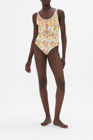 Detail view of model wearing CAMILLA swimwear reversible one piece swimsuit in An Italian Welcome print