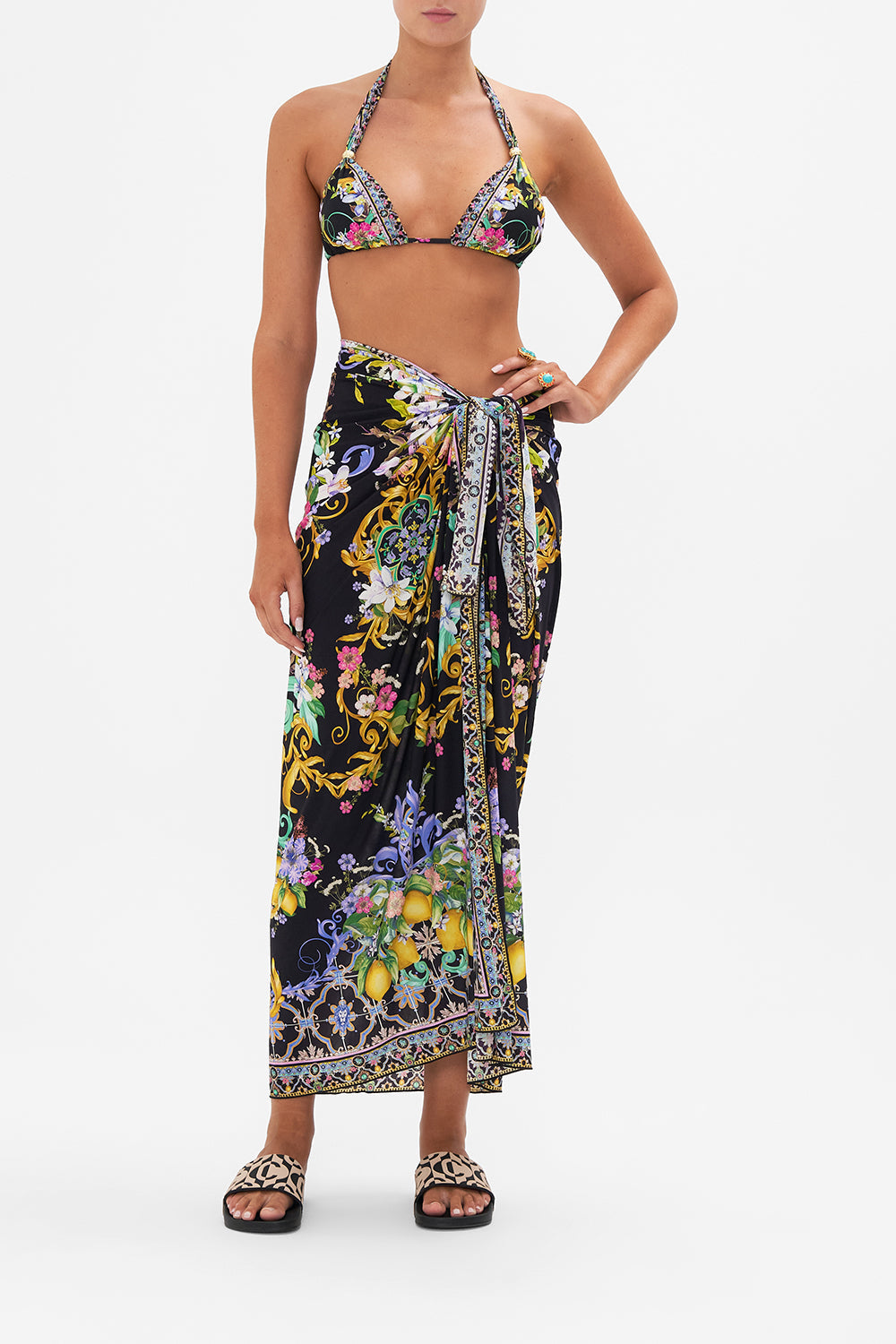 Front view of model wearing CAMILLA  resortwear black floral print sarong in Meet Me In Marchesa print